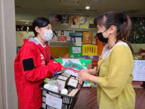 Delivering relief supplies to a community in Saga