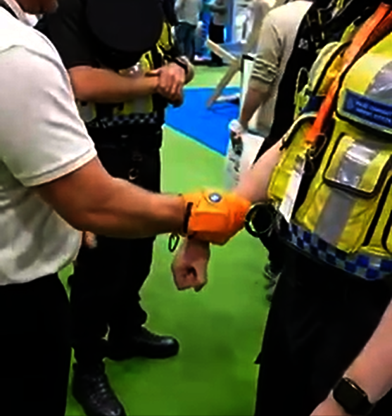 Electric shock glove promoted at a UK trade fair