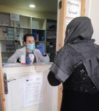Pharmacist dispenses medicine provided by our team