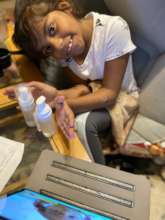 Kids learning how to make liquid soaps