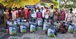BASS distributes roof sheets to waste picker huts