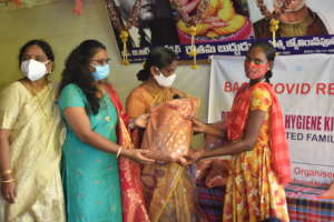 Distributing clothes to children in the community