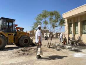 RI Staff surveying facilities construction.