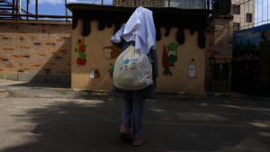 A girl going home from school after gradution