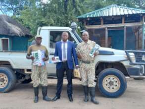 Rangers receiving rechargeable torches and Moringa