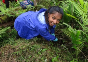 Young student hard at work with a smile
