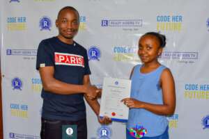 A student receiving her graduation certificate