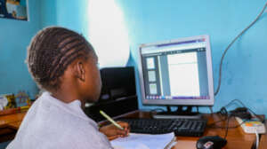 Agnes Mwende a grade 3 girl doing her homework