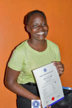 A student receiving her graduation certificate