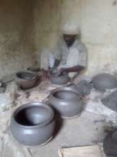 Potter in his studio.