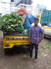 Faiza's father with his vegetable busines
