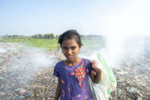 A child collecting garbage