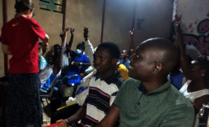 Bashir (front), English class led by UK volunteer.