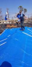 Tarping roofs