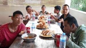 SILA residents are enjoying a meal together.
