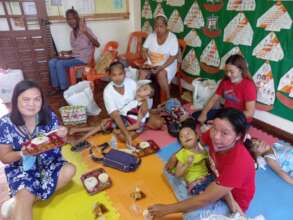 Pediatric clients with their mother at lunch time