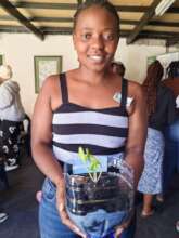 MCC Participant with her spinach plant