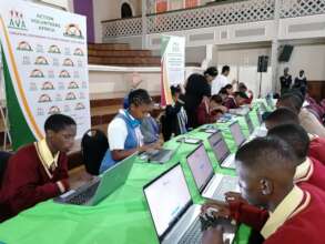 Learners at a career expo visit the MCC stand