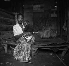 Batwa woman with child