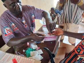 Testing a child for Malaria before treatment