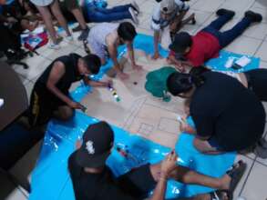Youth representing their reflections in paintings