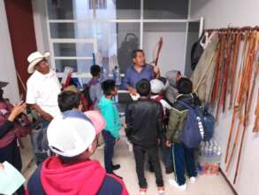 Youth learn about traditional staffs of authority