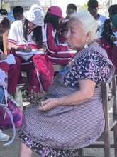 Traditional healer in dialogue with students