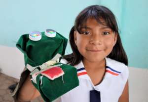 Young girl makes puppet to represent legend