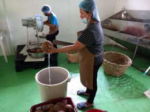 Splitting and grating the coconut for coconut oil