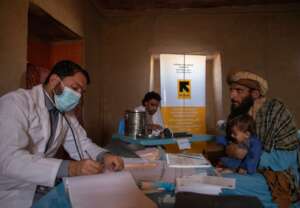Dr. Ibrahimi speaks with a father of 10-month-old.