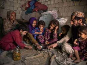 Afghan mother and father with their children.