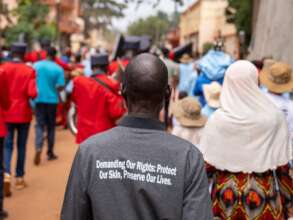 A parent of a child with albinism at IAAD march