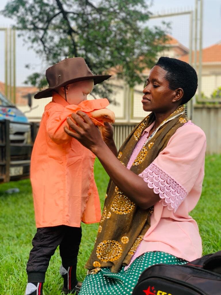 Young boy trying out a long-sleeved shirt at IAAD