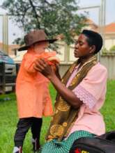 Young boy trying out a long-sleeved shirt at IAAD
