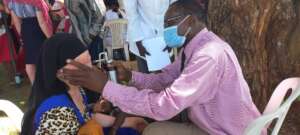Dr. Ngobi providing cryotherapy at IAAD clinic