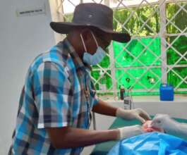 Dr. Ngobi undertaking minor surgery