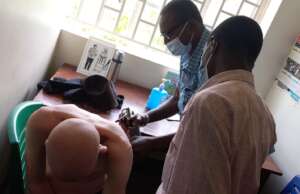 Dr Ngobi administering cryotherapy in Budaka