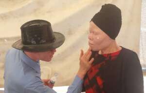 Edmond of SNUPA demonstrates sunscreen application