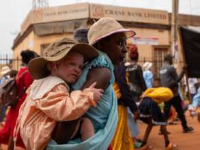 Mother & child in Jinja for IAAD march and clinic