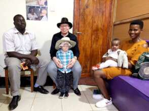 Peter (centre) welcomes a family to the office