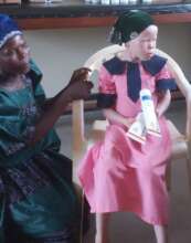 Mother with her daughter awaiting her skin check