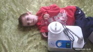 Bohdanchyk (7 y.o.) with the aspirator