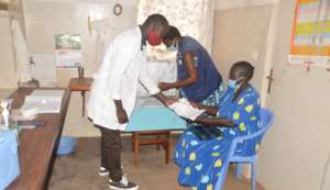 Client receiving medicine from the drug bank