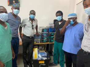 Doctors at La Paix Receiving ORSI aid shipment.
