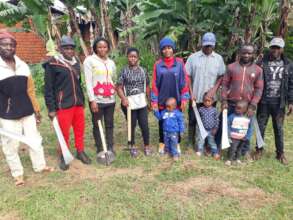 Group picture with farmers and their tools