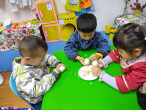 Children eating eggs at a village school