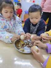 Children eating eggs at a village school