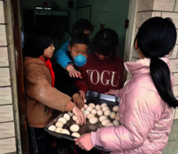 Village teachers handing out eggs