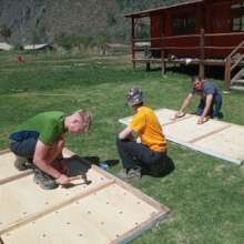 Volunteers working on new climbing wall