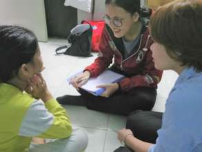 Our staff talk to a child at her house
